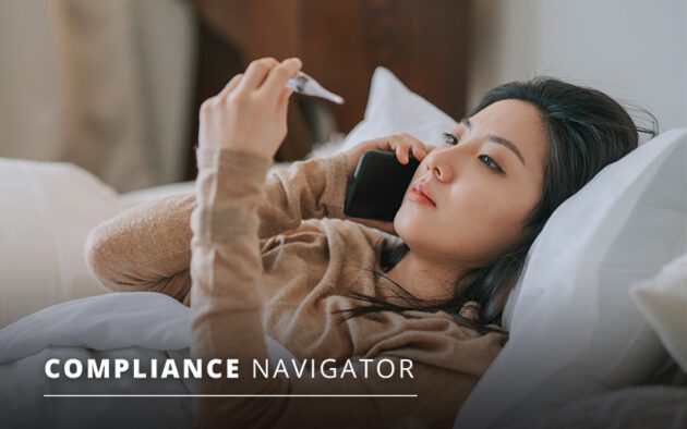 Woman laying in bed talking on phone while looking at a thermometer