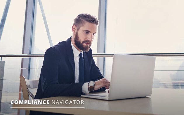 Man in business clothing working on a laptop