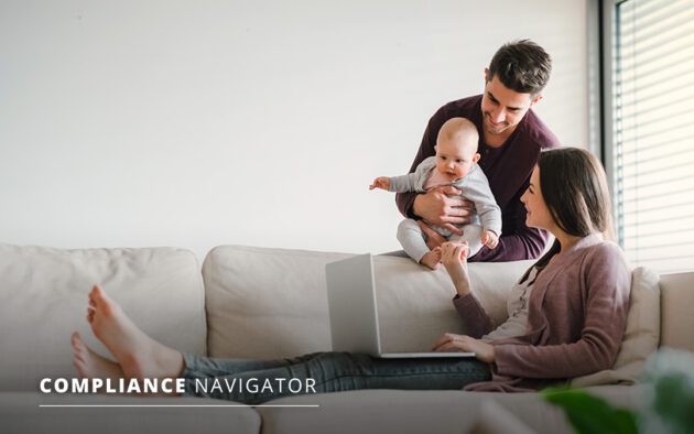 Family in their living space looking at a laptop together