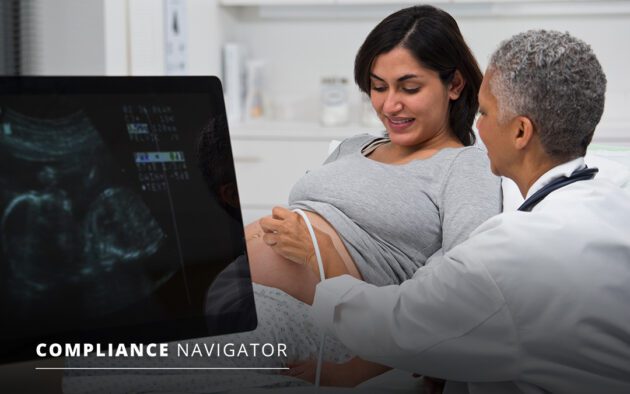 Woman getting an ultrasound by a doctor
