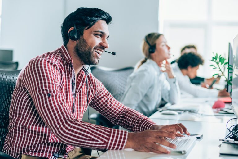 man talking in office on headset