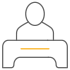 Icon of a person sitting at a desk, depicted in a minimalist style with a thin horizontal line on the desk.